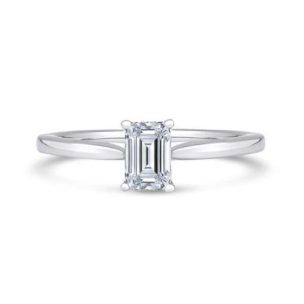 Emerald solitaire showing how engagement ring band width meets the centre setting