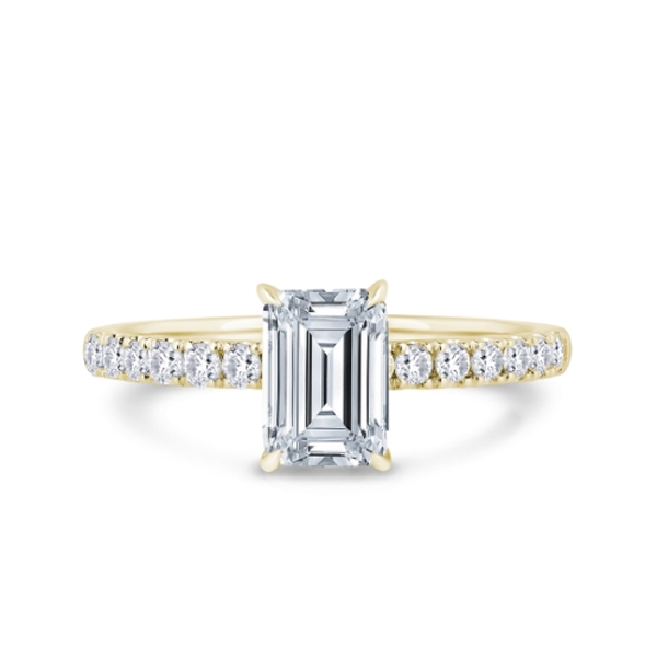 Wed fit engagement rings illustrated by a Kinzy emerald ring with raised centre architecture