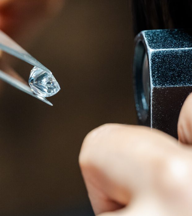 Family diamond engagement ring assessed before a new Kinzy London setting is made