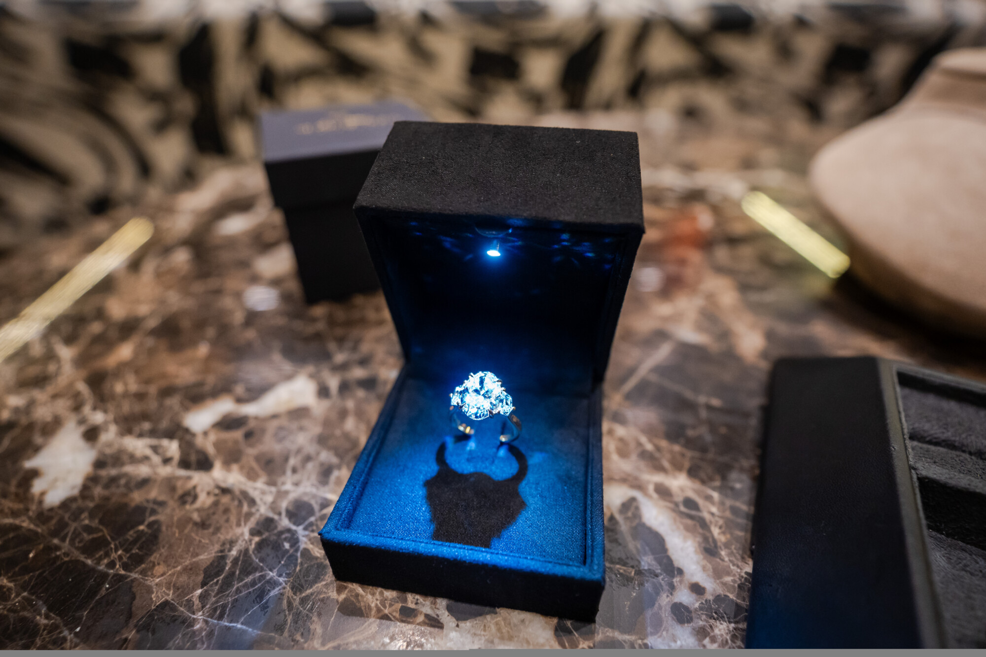 Engagement ring as a surprise presented in a Kinzy London ring box
