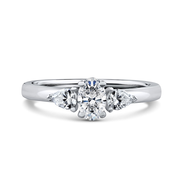 Kinzy London oval and pear side-stone trilogy engagement ring in platinum