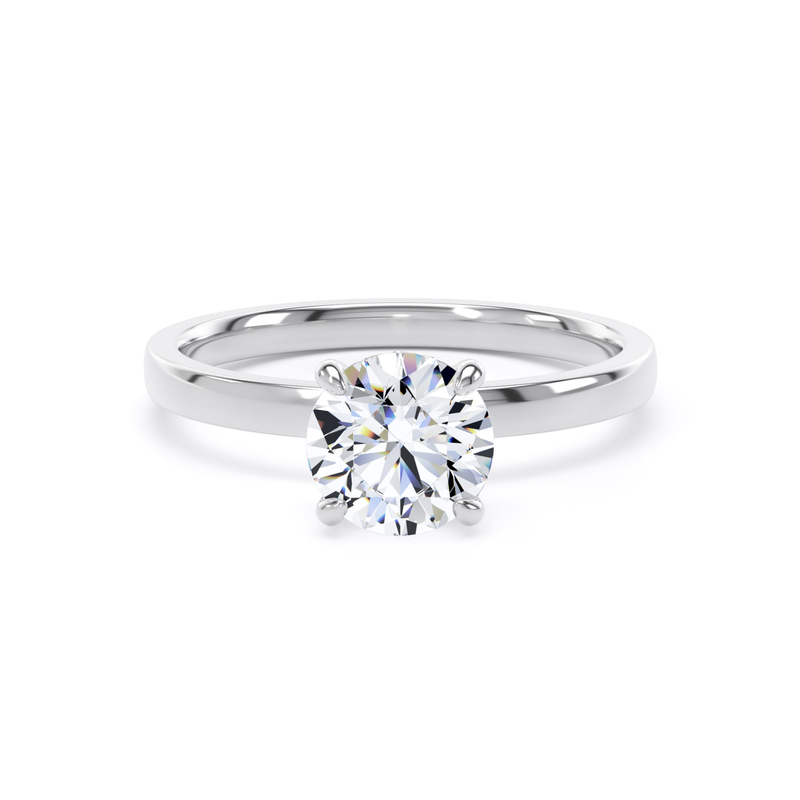 Kinzy London high-set traditional four-claw round engagement ring in platinum