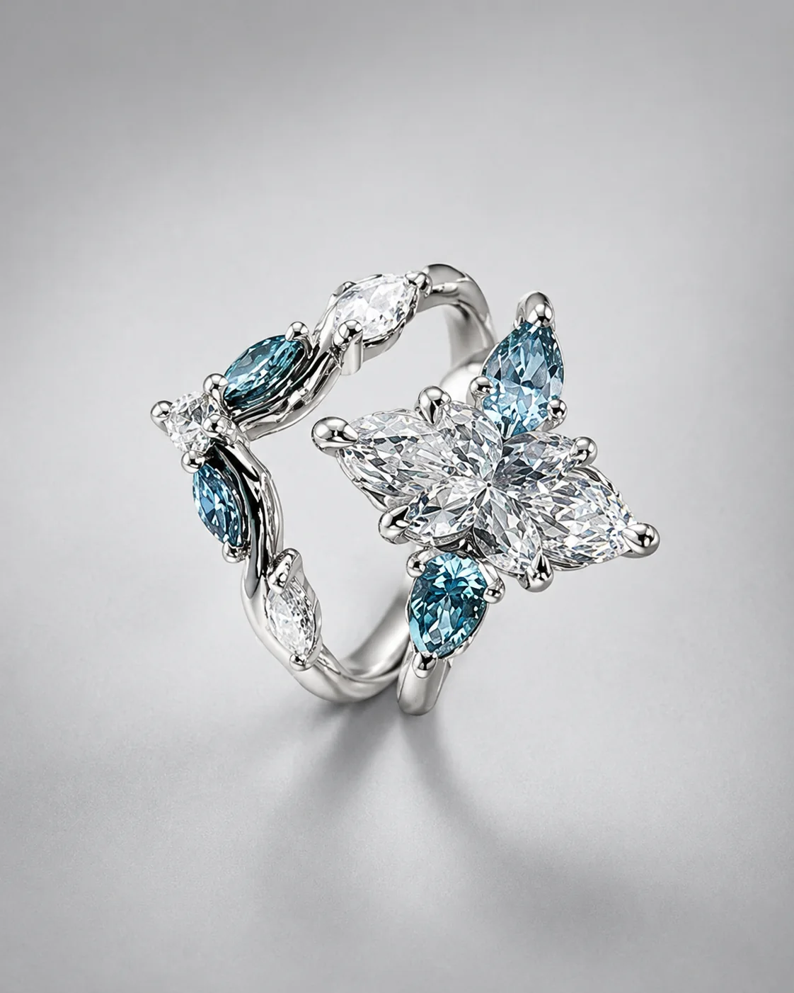 A sculptural Kinzy ring set with white and blue gemstones
