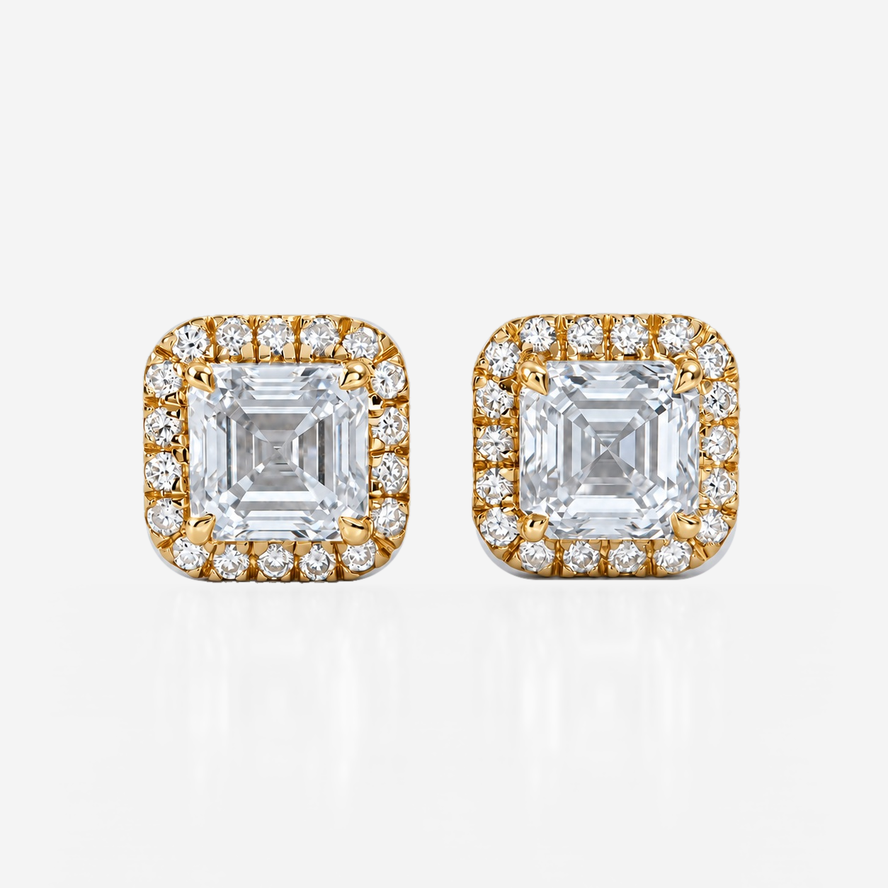 asscher halo studs in yellow gold