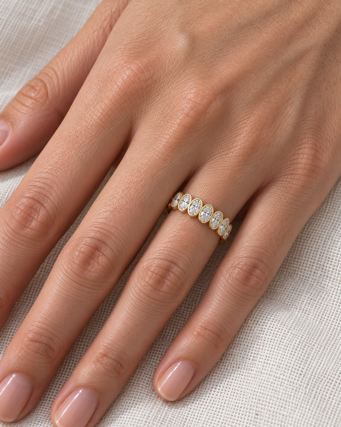 Diamond eternity band worn on the ring finger