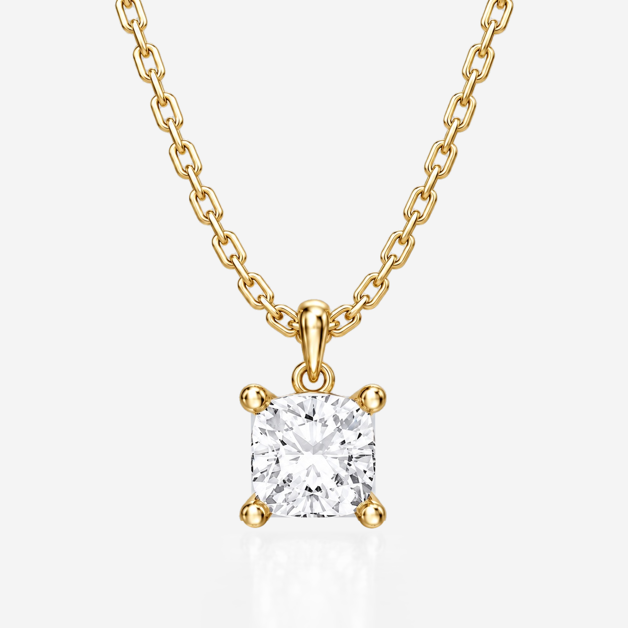 Cushion diamond solitaire pendant in yellow gold