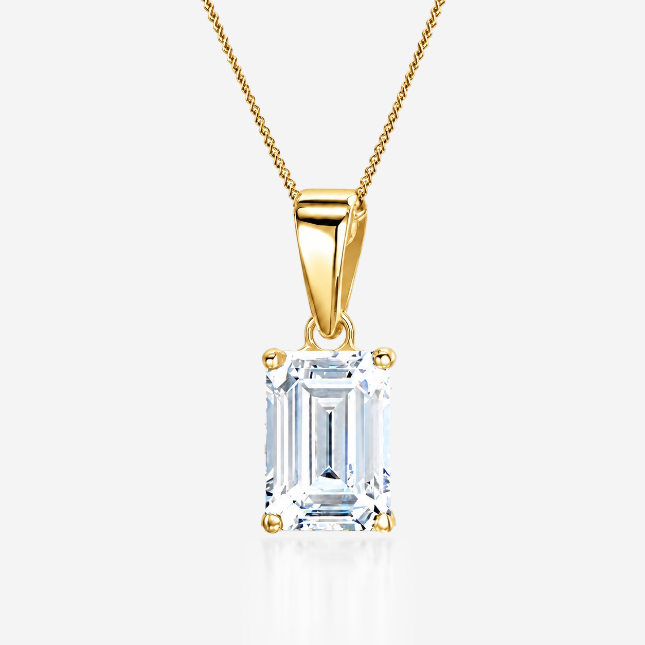 Emerald diamond solitaire pendant in yellow gold