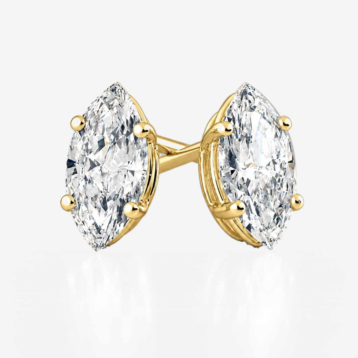 four claw marquise studs in yellow gold