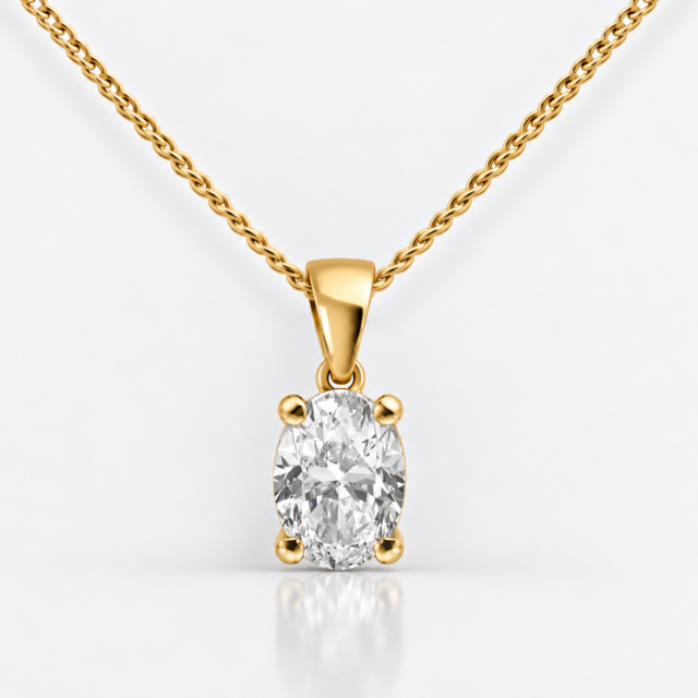 Front view of a four-claw oval diamond solitaire pendant in yellow gold with a fine curb chain