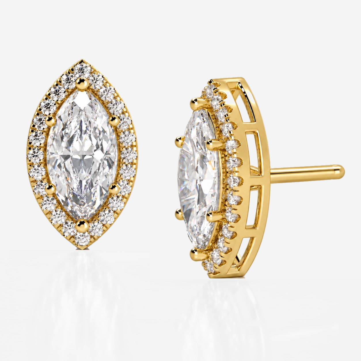marquise halo studs in yellow gold