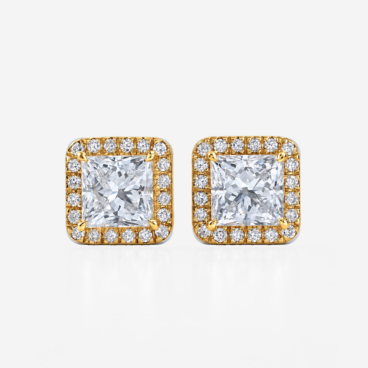 princess halo studs in yellow gold