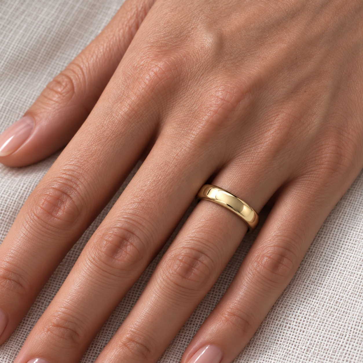 4mm Full Court wedding band in yellow gold worn on the ring finger