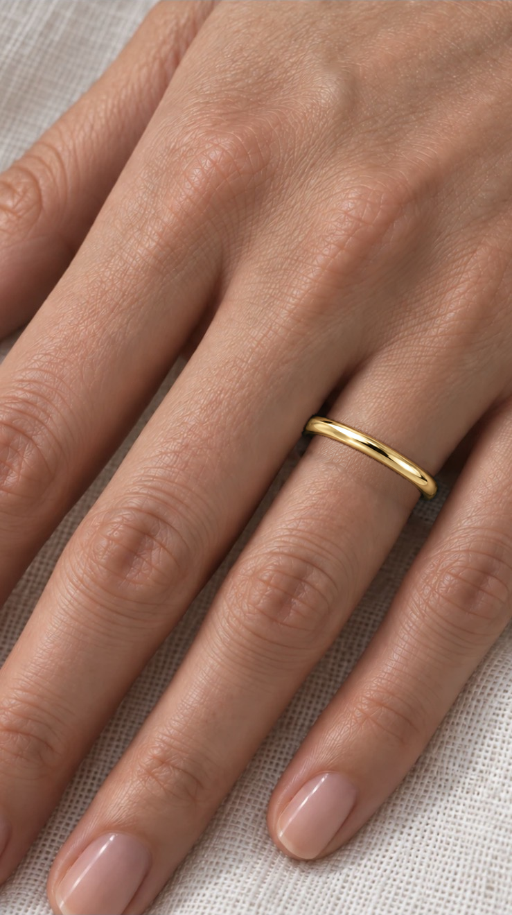 2mm D Shape Wedding Band in yellow gold worn on the ring finger