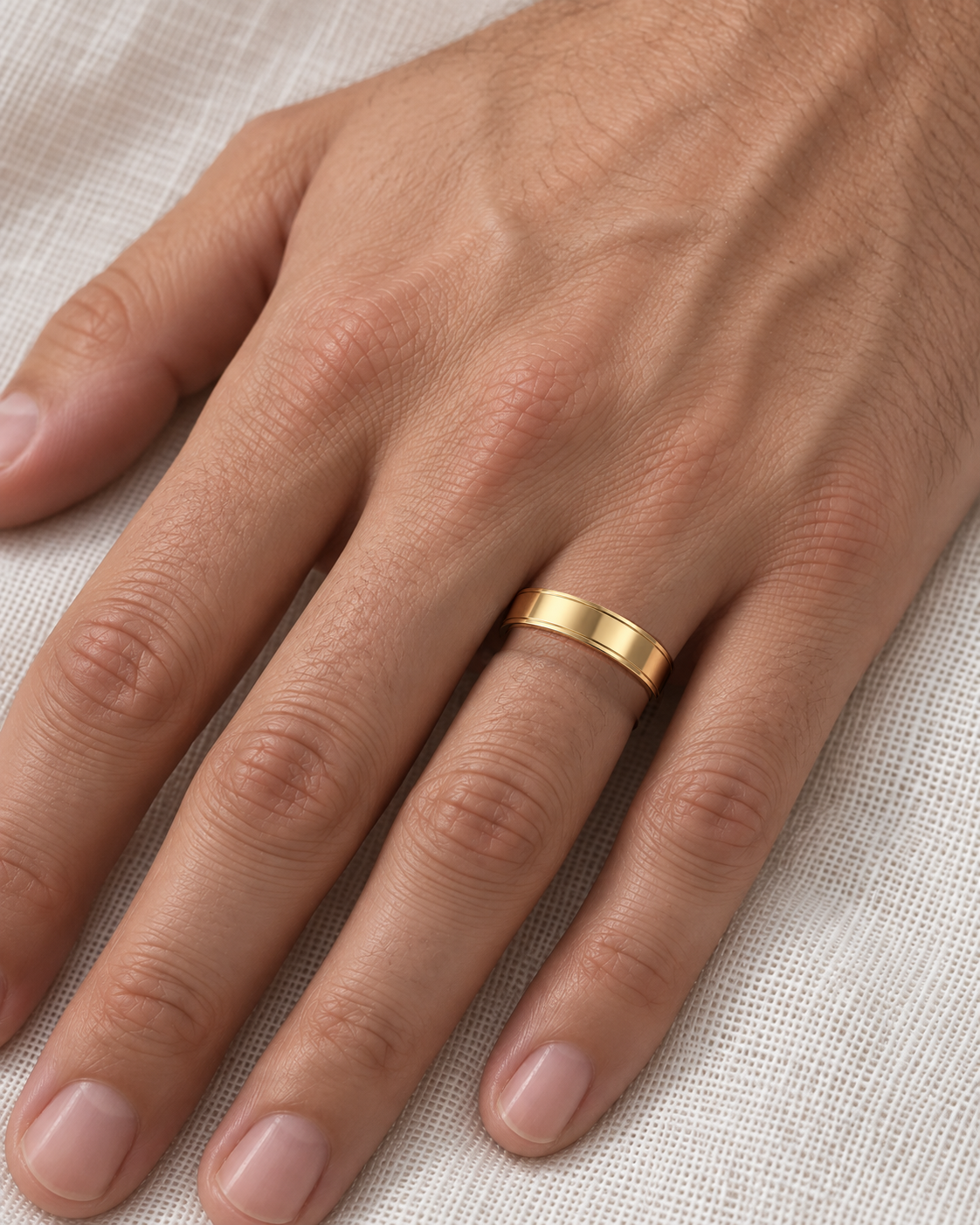 4.5mm Two Outer Bright Lines Wedding Band in yellow gold worn on the ring finger