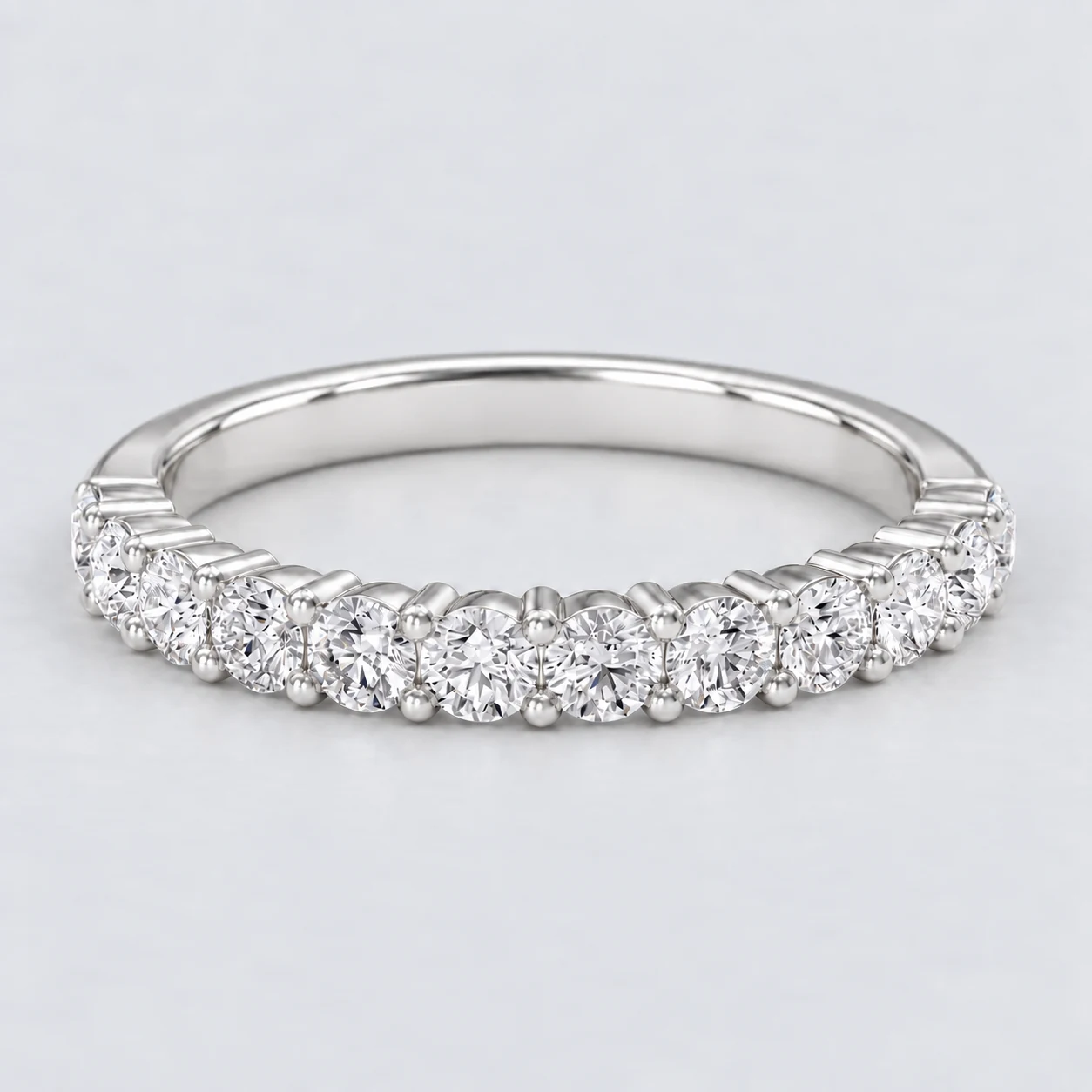 Round Shared Prong Diamond Eternity Ring, half eternity in Platinum